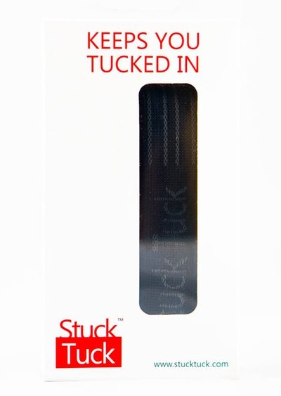 Front of the Stuck Tuck box: a window showing the belt, the line Keeps You Tucked In, and the logo