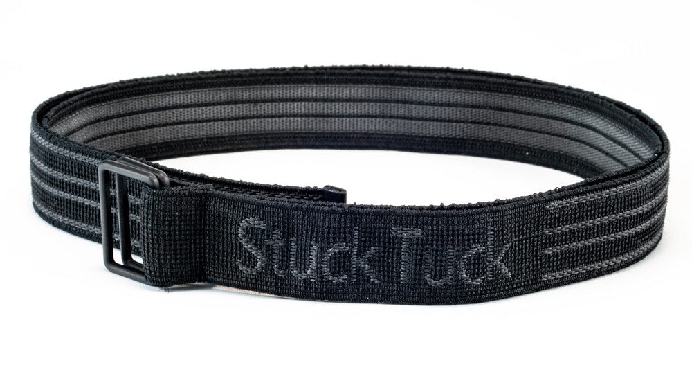 Stuck Tuck shirt stay belt, a black elastic band with gray stripes, the Stuck Tuck name, and a slide buckle